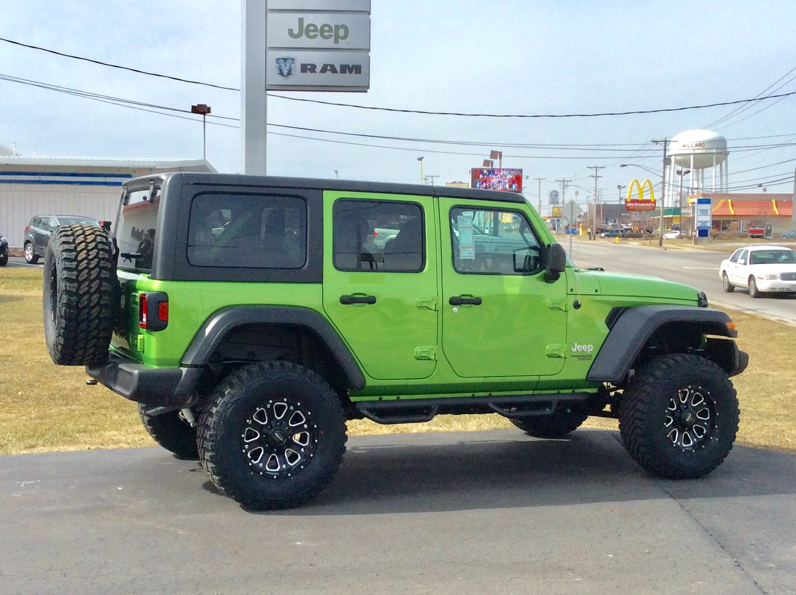 lifted JK Wrangler 2014 Dune color with Atlas bumpers from DSI